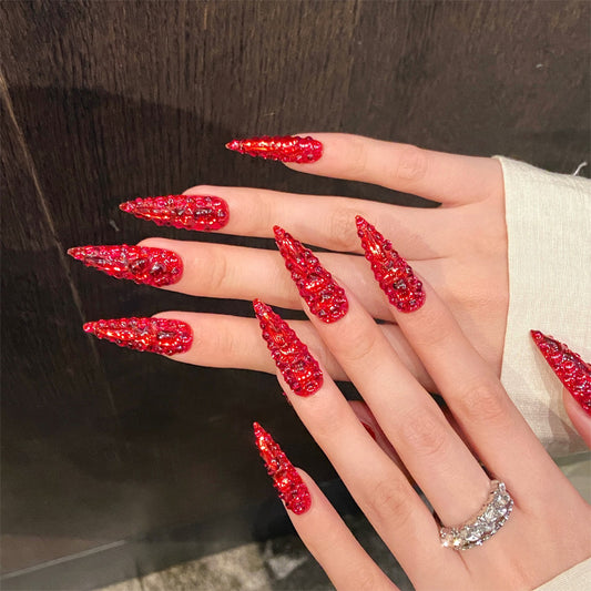 Red glitter stiletto nails