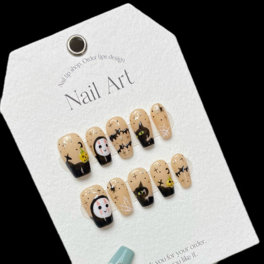 Adorable Halloween kawaii ghost cat coffin medium press-on nails with cute ghosts, mysterious black cats, and sparkling star designs