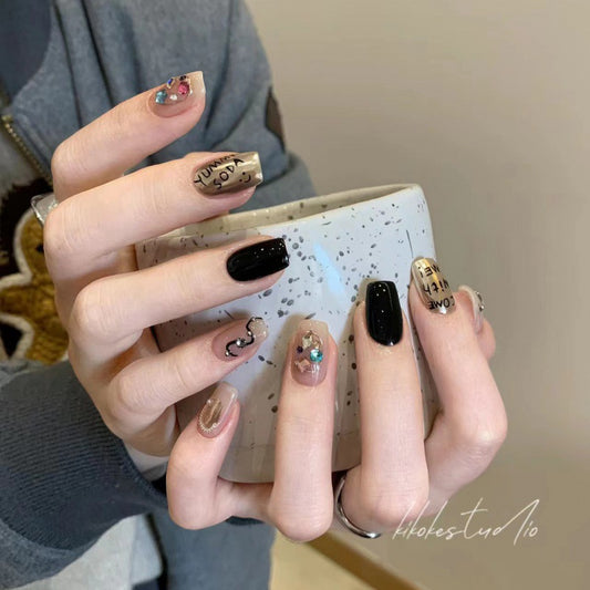 Bold coffin medium press-on nails with black, nude, gold & crystals - perfect for boss babes, business meetings & power style confidence