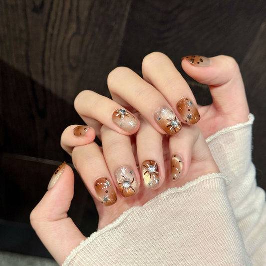 Bold squoval short nails with leopard print, silver stars, moon & brown gradient - perfect for leopard star moon shimmer charm & celestial wild style"