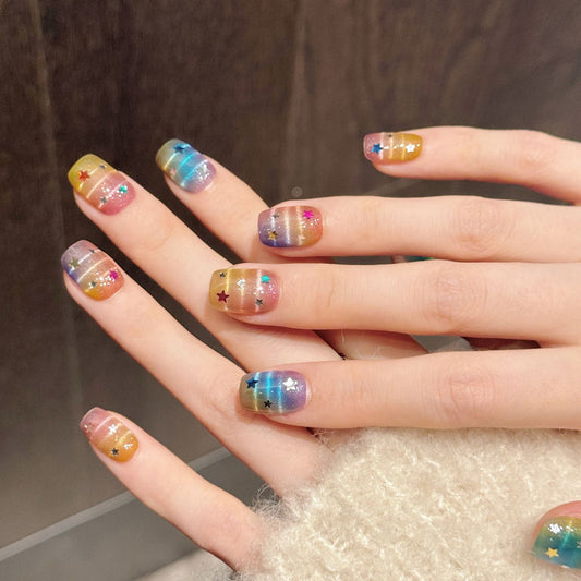 Dreamy squoval press-on nails featuring seamless rainbow gradient & colorful stars - Pride & festival beauty at home - Set of 10 nails