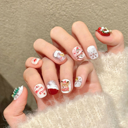 Festive squoval short nails with 3D Christmas tree, snowman, reindeer & Merry Christmas text - perfect for holiday cheer & Christmas celebrations