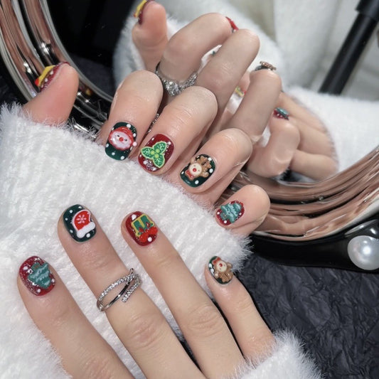 Festive squoval short press-on nails with 3D Santa, reindeer, tree & gingerbread - perfect for Christmas celebrations & spreading holiday joy