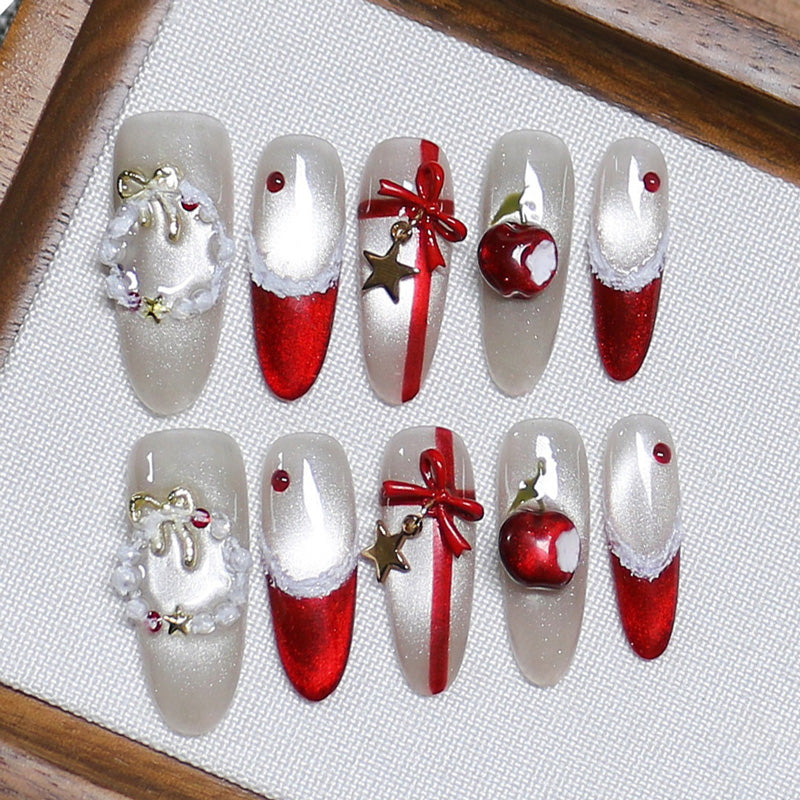 Glamorous stiletto long press-on nails with red ombre, silver wreaths, ribbon bows & crystals - perfect for Santa's glamour & Christmas parties