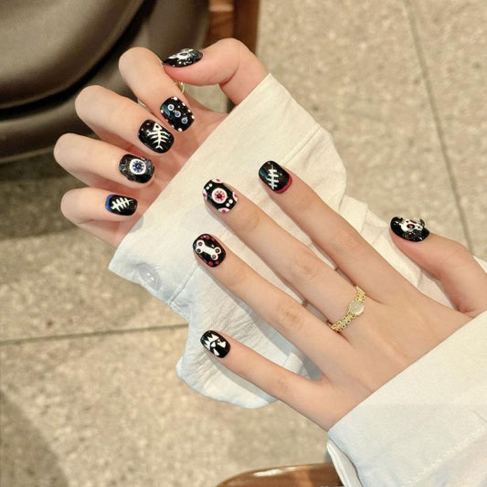 Gothic Halloween skull eye oval short press-on nails with intricate skull designs, mystical eyeballs, and spooky bone patterns for dark style