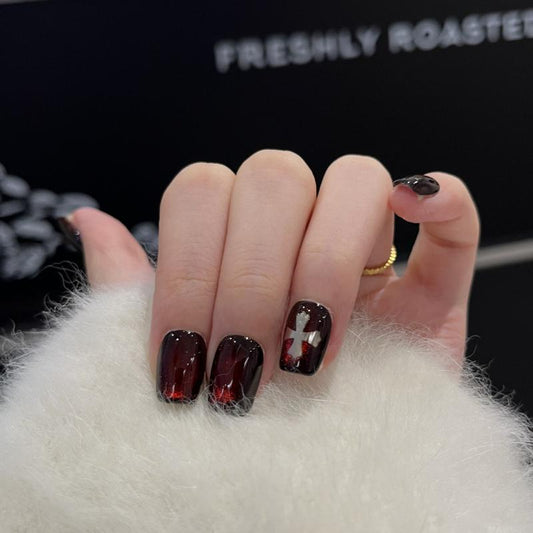 Handcrafted Halloween nails featuring dramatic burgundy gradients, sacred cross designs - coffin short shape for gothic elegance