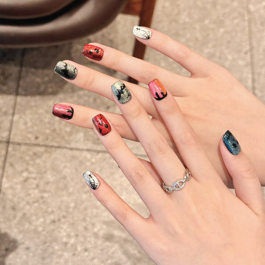 Handcrafted Halloween nails with dazzling glitter skull designs, squoval short shape, professional application kit included