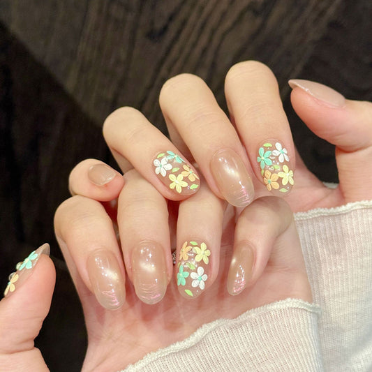 KAPOWNAILS oval nails featuring spring design - delicate hand-painted flowers, soft nude gradient, pastel colors, gold beads, handcrafted quality, 10-piece set