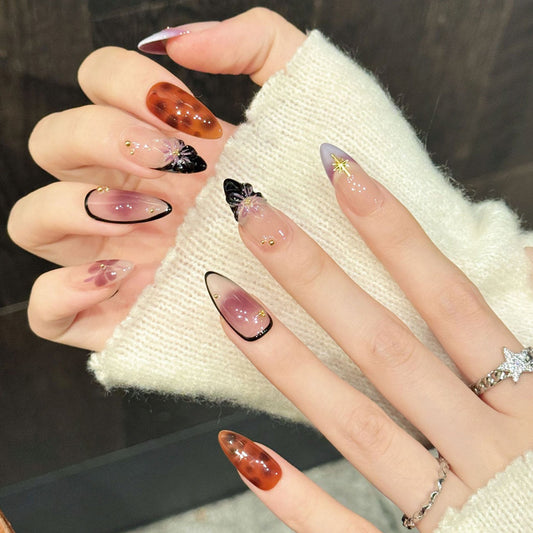 Mesmerizing almond press-on nails featuring multi-tonal ombre, translucent petals & gold starbursts - Ethereal beauty at home - Set of 10