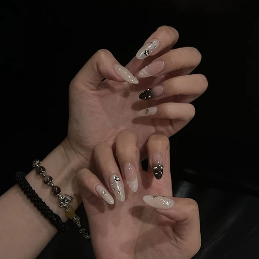 Premium handmade almond press-on nails with edgy star studs, gradient ombré effects & dramatic 3D embellishments