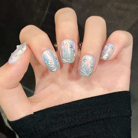 Premium handmade chrome mirror press-on nails with holographic effects. Dual shapes: stiletto long & squoval short options