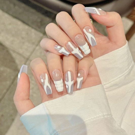 Premium handmade coffin medium nails with intricate skeleton bone designs on nude base. Gothic-inspired alternative nail art.