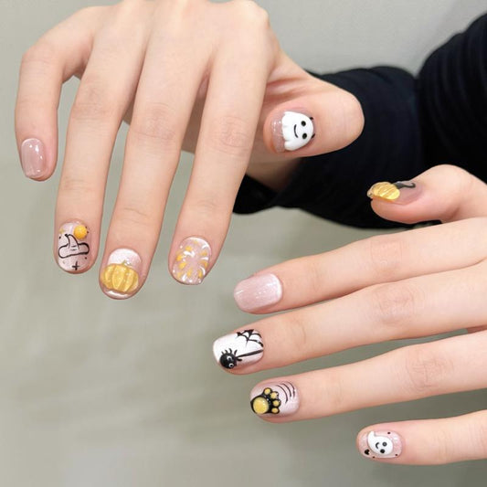 Professional quality Halloween press-on nails with cute pumpkin theme, oval short design, complete with application kit and guide
