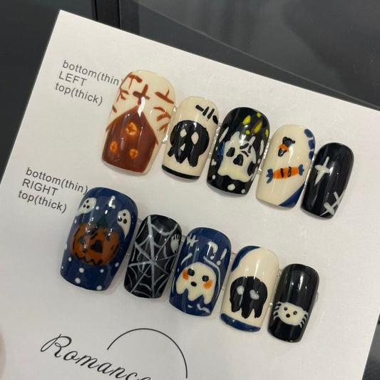 Spooky Halloween skull web coffin medium press-on nails with intricate spider webs, cute skulls, and charming pumpkin designs