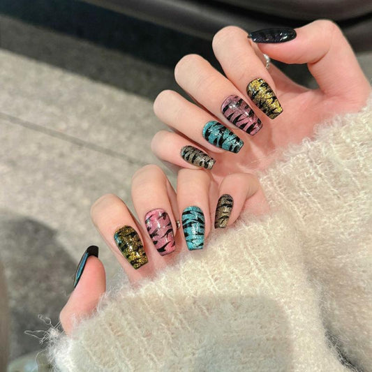 Stunning Halloween holographic mummy coffin medium press-on nails with color-shifting effects, ancient bandage patterns in vibrant colors