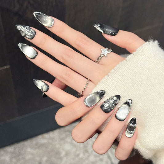Stunning almond press-on nails featuring chrome ombre, silver flower charm & white dots - Futuristic beauty at home - Short & medium lengths