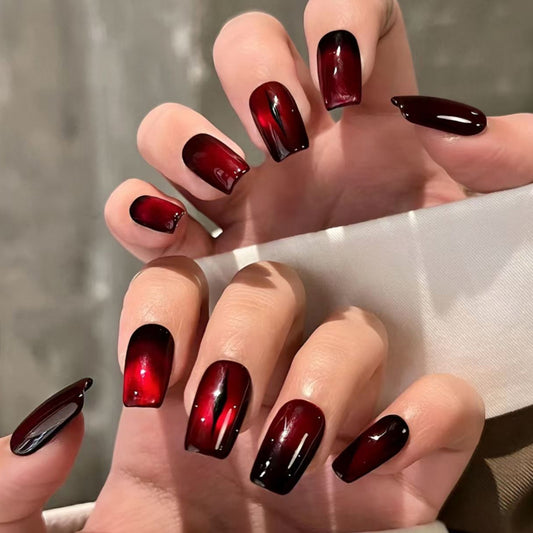 Stunning coffin short press-on nails with vampire-inspired red to black ombre - gothic chic style, handcrafted quality, perfect fit