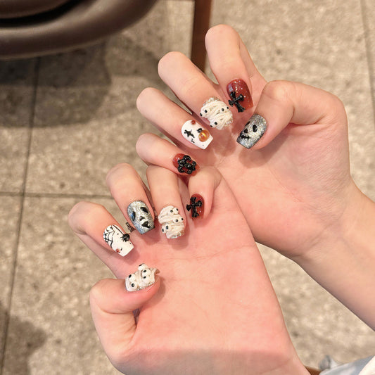 Transform your Halloween look with handcrafted skull press-on nails featuring gothic patterns and spooky designs
