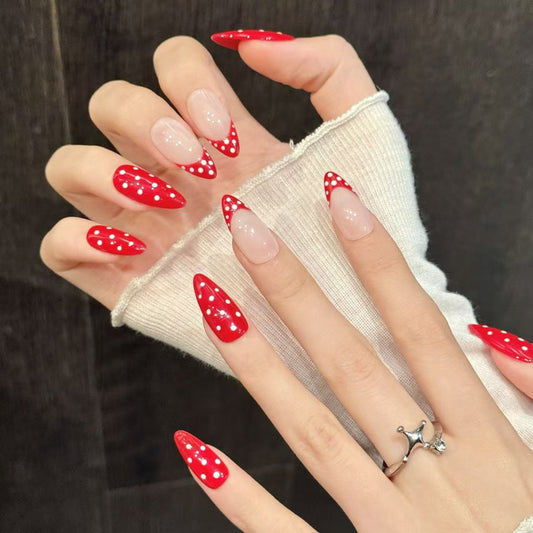 Vintage-inspired polka dot design on glossy red almond press-ons with nude balance - reusable 10-piece professional quality set