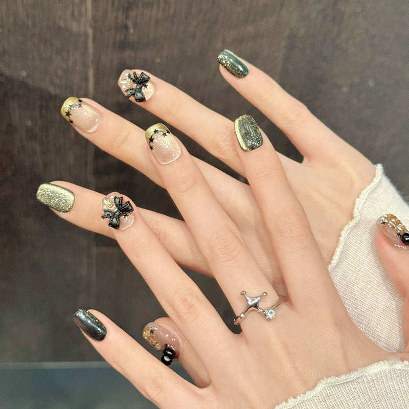 Premium coffin nails for festive sophistication - 3D gold Christmas tree, elegant black bow, sparkling green glitter, perfect for Christmas celebrations