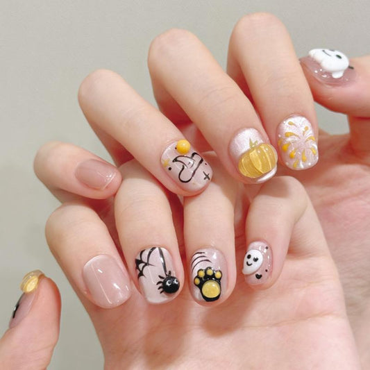 Adorable Halloween cute pumpkin ghost oval short press-on nails with 3D pumpkin charms, friendly ghosts, and playful spider designs