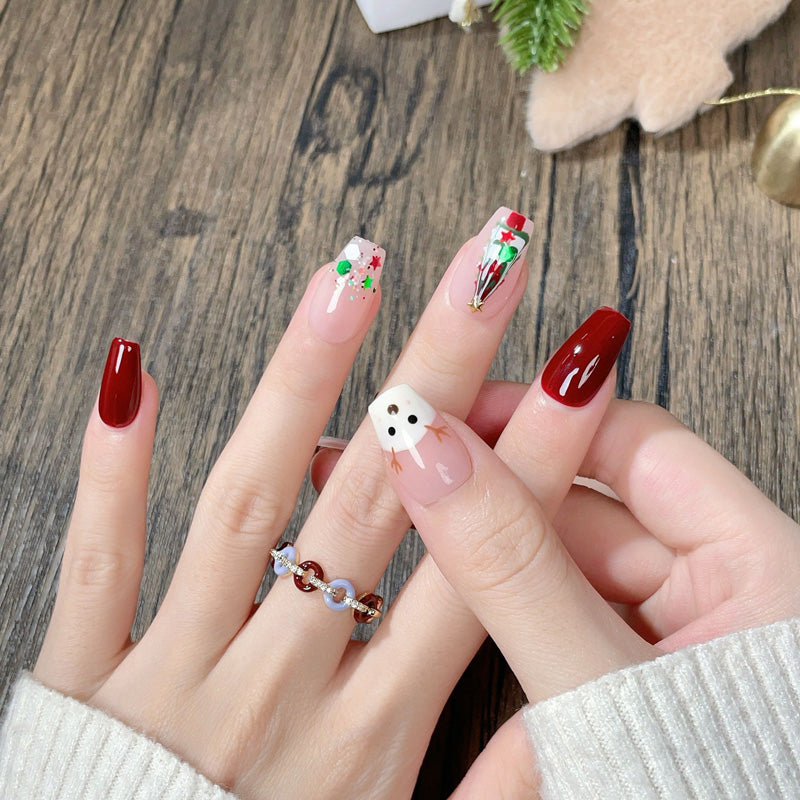 Adorable coffin short press-on nails with reindeer, Christmas tree & festive confetti - perfect for reindeer fun & holiday celebrations