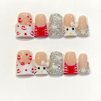 Adorable handmade duck nails with Hello Kitty character, red smiles & silver glitter - Festive kawaii holiday charm - Applies in 15 minutes