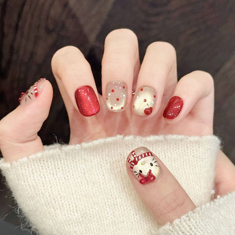 Adorable squoval press-on nails featuring Hello Kitty, sparkling red glitter & rhinestones - Cute holiday fun - Complete set of 10