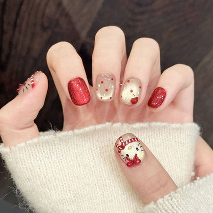 Adorable squoval press-on nails featuring Hello Kitty, sparkling red glitter & rhinestones - Cute holiday fun - Complete set of 10