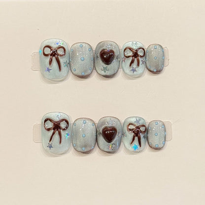 Adorable squoval short nails with 3D bows, burgundy hearts, jelly base & holographic stars - perfect for sweet bow heart jelly charm & kawaii style