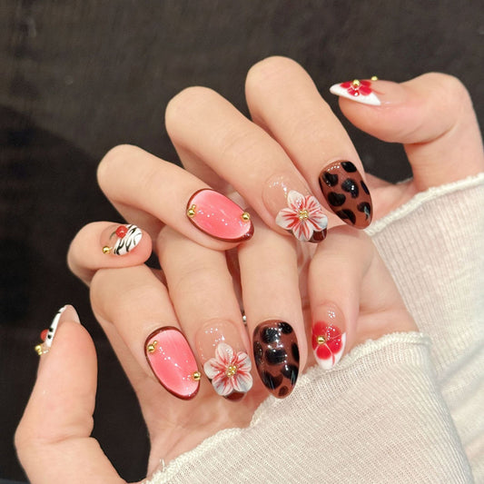 Bold almond nails with 3D pink flower, leopard, zebra, cherry & pink gloss - perfect for pink flower leopard zebra cherry playful elegant charm"