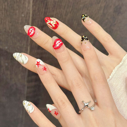 Bold almond nails with red lips, stars, zebra stripes & gold beads - perfect for red lips star zebra gold bead edgy glam & statement style