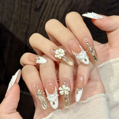 Bridal almond nails with 3D white flower, pearl lace, gold glitter & French tips - perfect for white flower pearl gold glitter French romantic charm