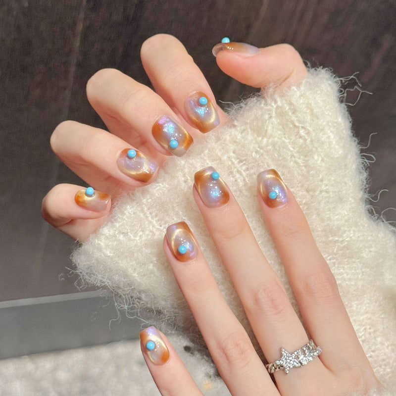 Captivating squoval press-on nails featuring translucent sunset tones, turquoise cabochons & aurora shimmer - Southwestern beauty - Set of 10