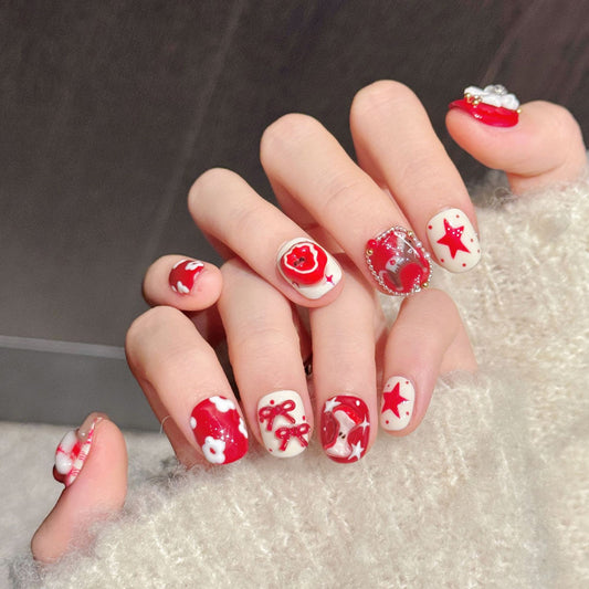 Charming squoval press-on nails featuring Christmas bows, star accents & candy cane stripes - Holiday beauty at home - Complete set of 10