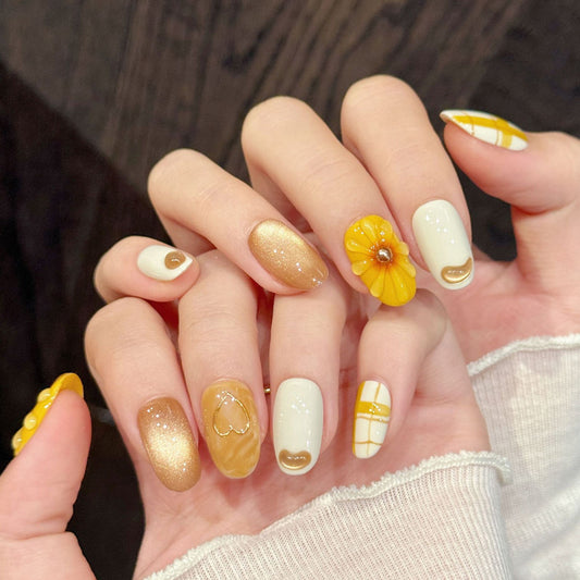 Cheerful almond nails with 3D yellow flower, plaid pattern, heart accents & gold shimmer - perfect for yellow flower plaid heart shimmer sunny charm