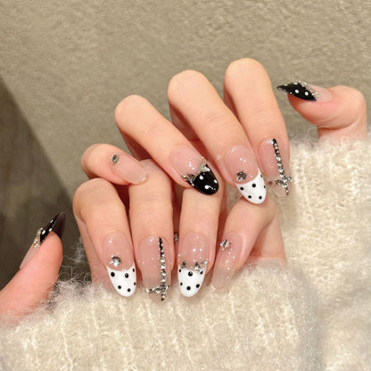 Chic almond nails with black-white polka dots, crystal crown & rhinestone borders - perfect for black white polka dot crystal crown elegant charm