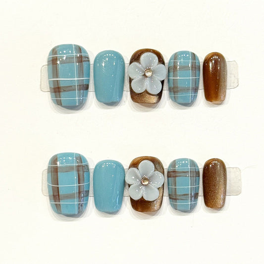 Cozy short squoval press-ons with classic plaid pattern, sky blue, chocolate brown & 3D white flower - handcrafted vintage charm