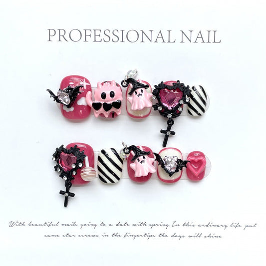 Cute pink gothic Halloween press-on nails with adorable skull designs, squoval short shape, perfect for spooky sweet style