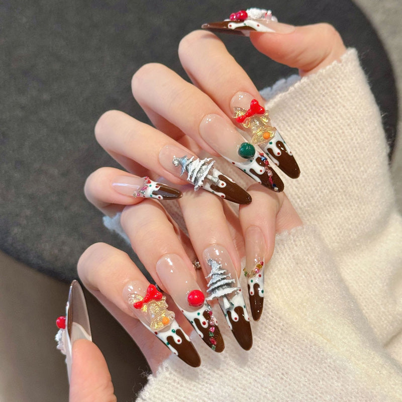 Delightful stiletto long press-on nails with 3D Santa, gold bells, tree, candy cane & chocolate drip - perfect for sweet Christmas treats & festive fun