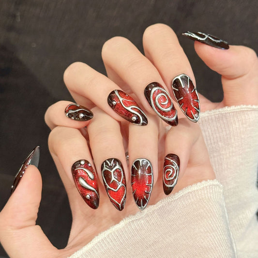 Dramatic almond nails with red glitter hearts, flame designs, silver outlines & crystals - perfect for red heart flame silver outline bold glamour