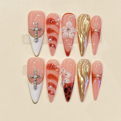 Dramatic extra-long stiletto press-ons featuring crystal crosses, molten gold chrome & marble art - handcrafted luxury statement nails