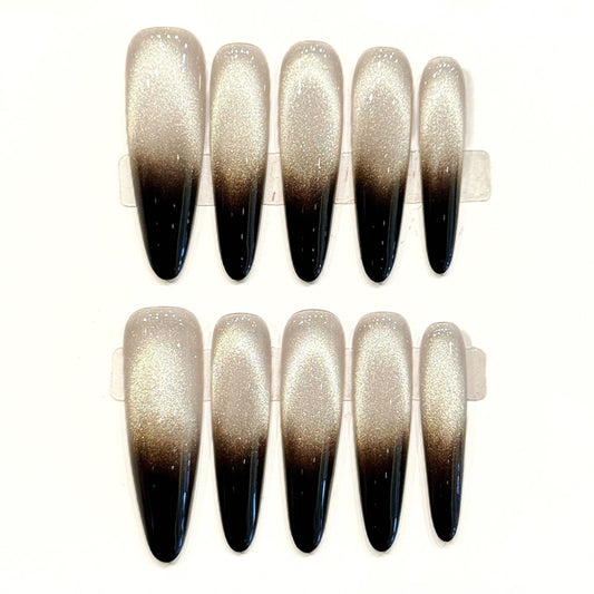 Dramatic extra-long stiletto press-ons with champagne-to-black gradient, iridescent shimmer & glossy finish - sophisticated ombré art