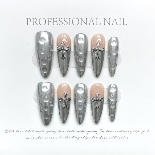 Dramatic stiletto long press-on nails with gothic cross design - chrome & nude finish, perfect for alternative fashion & dark romance