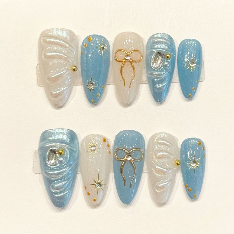 Dreamy handmade almond nails with sky blue, 3D bow & moon charms, star studs - Celestial elegance - Applies in just 15 minutes