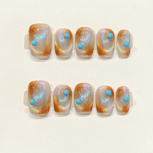 Dreamy handmade squoval nails with sunset jelly base, turquoise gemstones & iridescent shimmer - Boho desert magic - Applies in 15 minutes