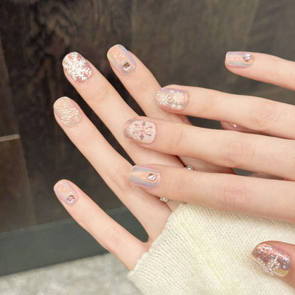 Dreamy nails featuring iridescent pastel ombré, delicate snow crystals & metallic sparkle - romantic 10-piece winter set