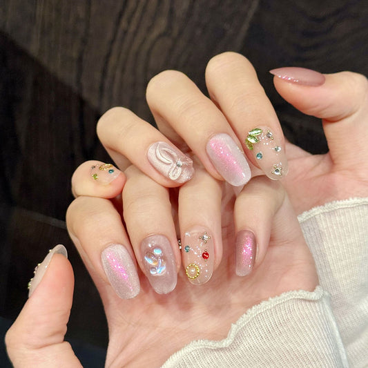 Dreamy oval nails with pink shimmer, butterfly, colorful crystals & gold circles - perfect for pink shimmer butterfly crystal charm romantic elegance