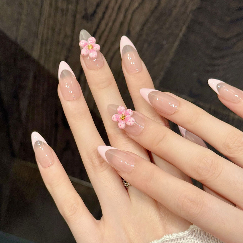 Dreamy pink almond nails with smooth color fade, hand-sculpted translucent petals & golden center - elegant romantic collection
