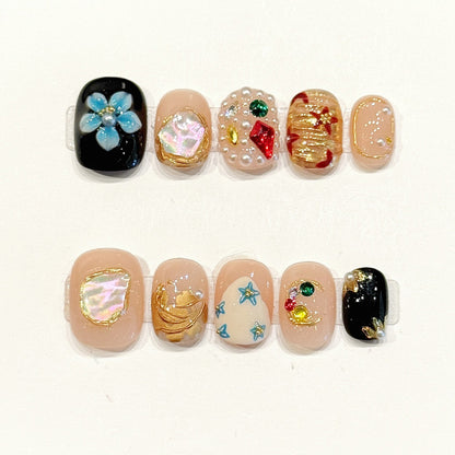 Dreamy short squoval press-ons with iridescent shells, delicate pearls, colorful stars & gold moons - handcrafted ocean-sky art